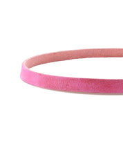 A close-up of the Bed Stu Monae pink suede choker necklace on a white background, ideal for adding a subtle boho touch to your style.