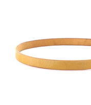 The Bed Stu Monae belt, in plain light brown leather, is displayed in a circular shape on a white background.