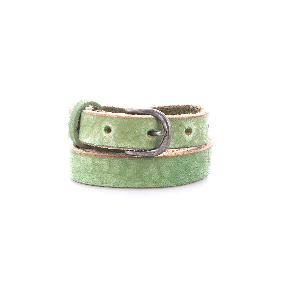 The Bed Stu Monae is a light green skinny leather belt with a silver buckle, neatly coiled on a white background—an ideal accessory for your boho style.