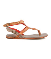 The Bed Stu Moon sandal features brown leather, two adjustable ankle buckles, a flat sole, cushioned insole, and red inner lining, displayed in a side profile view.