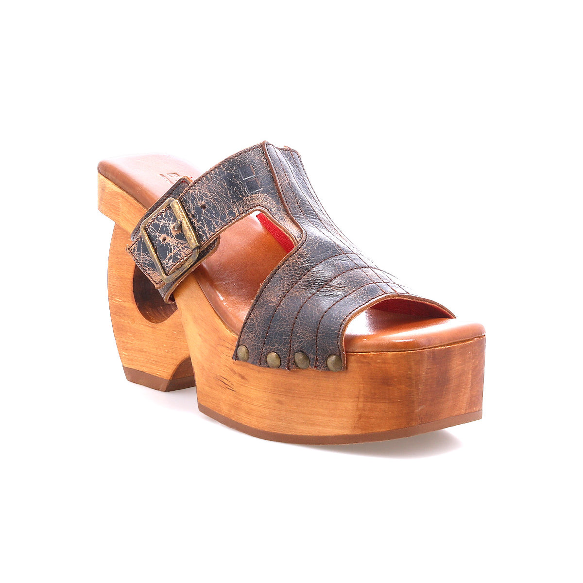 The Bed Stu Mutable is a single wooden platform clog sandal featuring a dark leather upper, decorative buckle, and stud accents with vintage flair, shown against a white background.