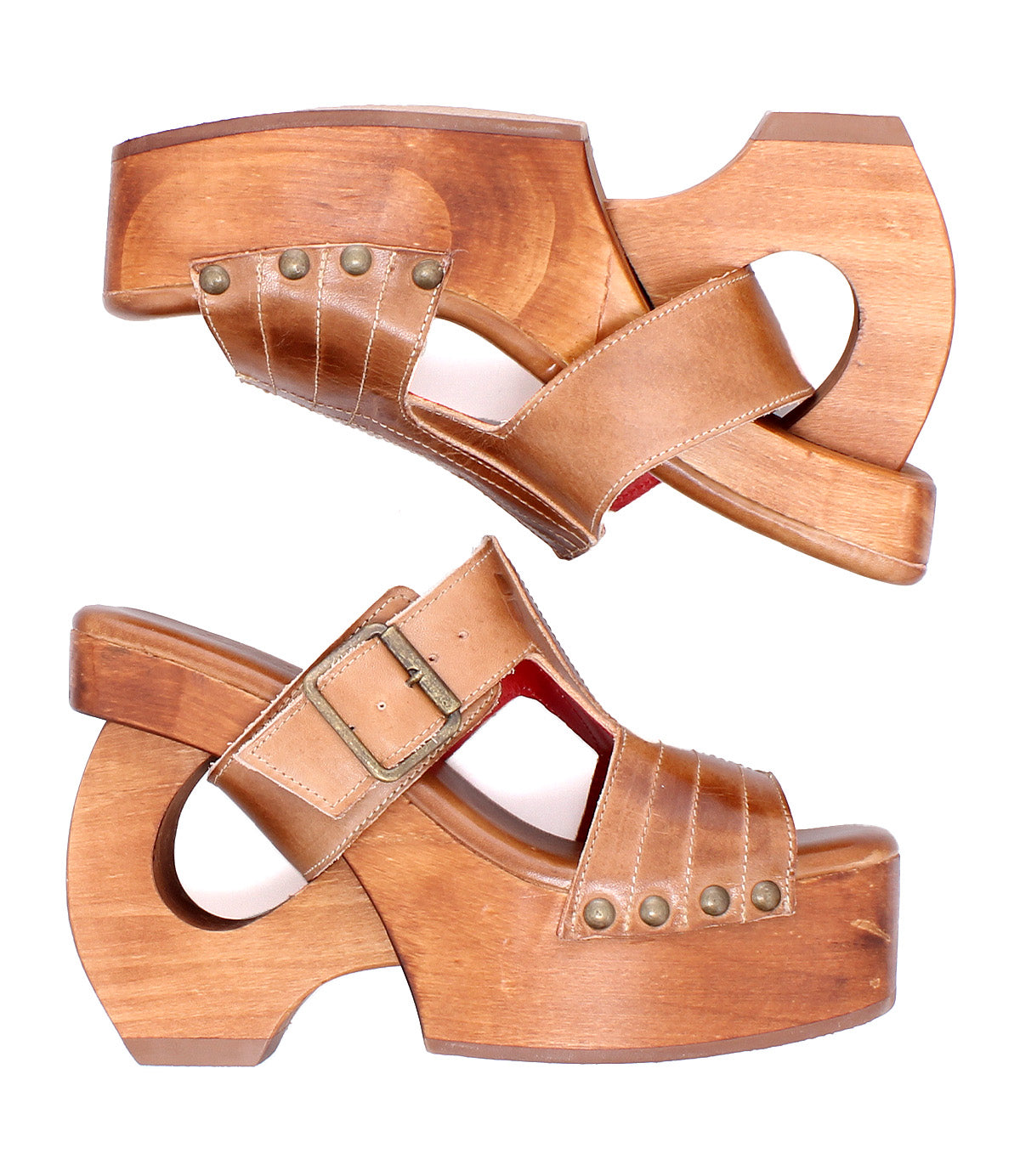 The Bed Stu Mutable sandals feature vintage wooden platforms, tan leather straps with metal studs, and a decorative buckle, shown side by side on a white background.