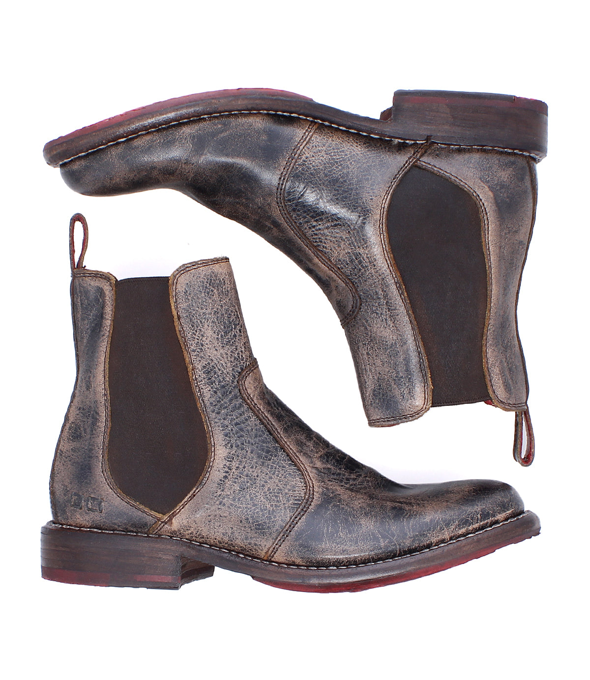 Two distressed brown leather Bed|Stü Nandi Chelsea boots with elastic side panels and red outsoles, a versatile footwear choice.