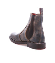Bed|Stü Nandi distressed brown leather Chelsea boot featuring elastic side panels, a stacked heel, and a versatile slip-on design.