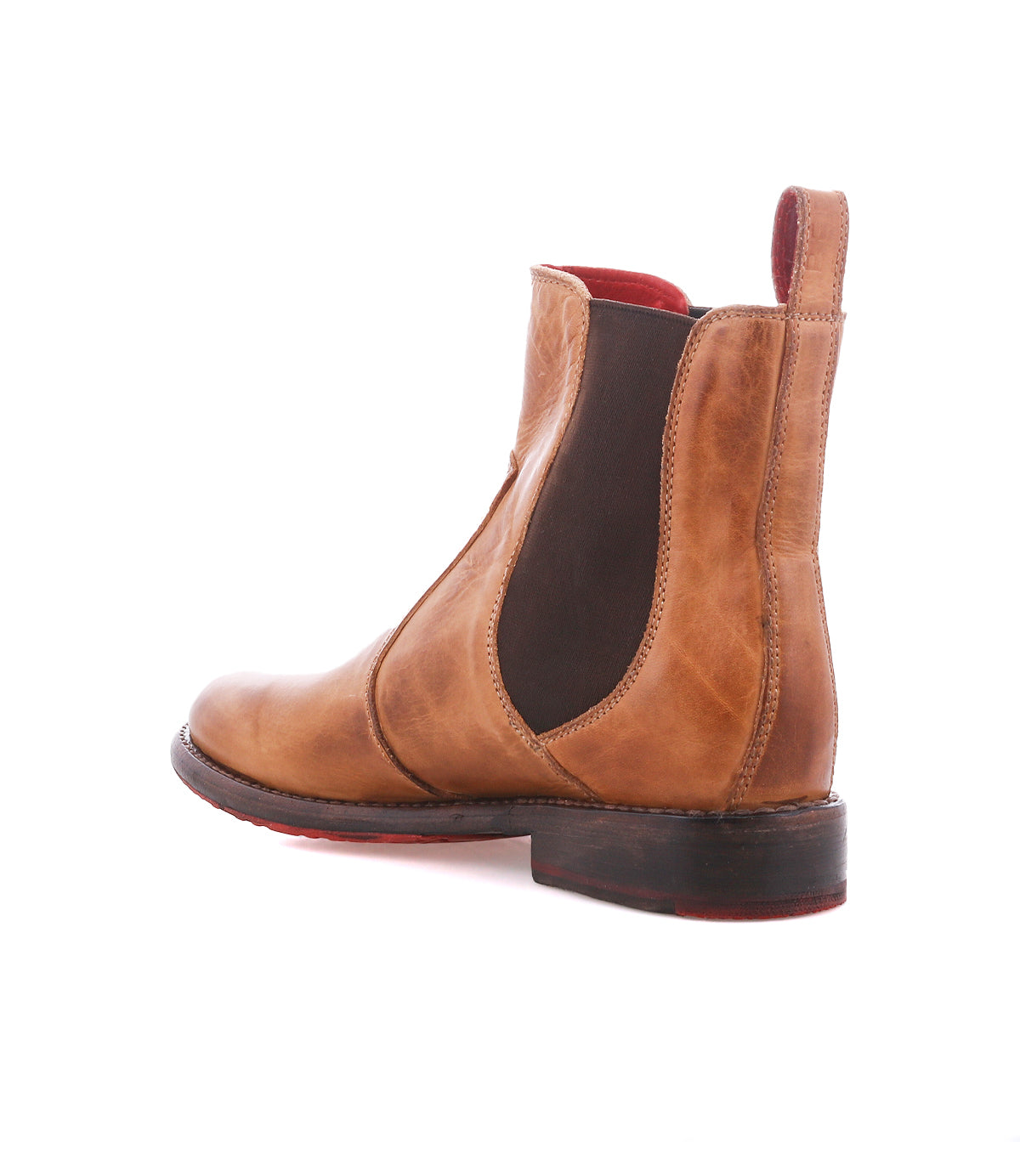 The Nandi by Bed|Stü: brown leather Chelsea boot with slip-on fit, elastic side panel, pull tab, low heel, and red sole accent; angled on a white background.