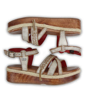 Pair of stylish wooden Necessary flatform sandals with stitched straps on a white background by Bed Stu.