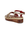 A single Necessary sandal by Bed Stu with adjustable brass buckle and a wooden platform sole against a white background.