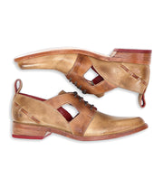 A pair of brown leather lace-up Neftis dress shoes by Bed Stu with cut-out details and a pointed toe for all-day comfort.