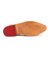 A Bed Stu leather shoe sole with a red rubber heel for all-day comfort.