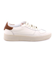 A high-quality leather white sneaker with a brown heel tab, beige sole, and white laces, viewed from the side. Perfect for those seeking classic white sneakers that blend timeless style with premium craftsmanship: the North by Bed Stu.