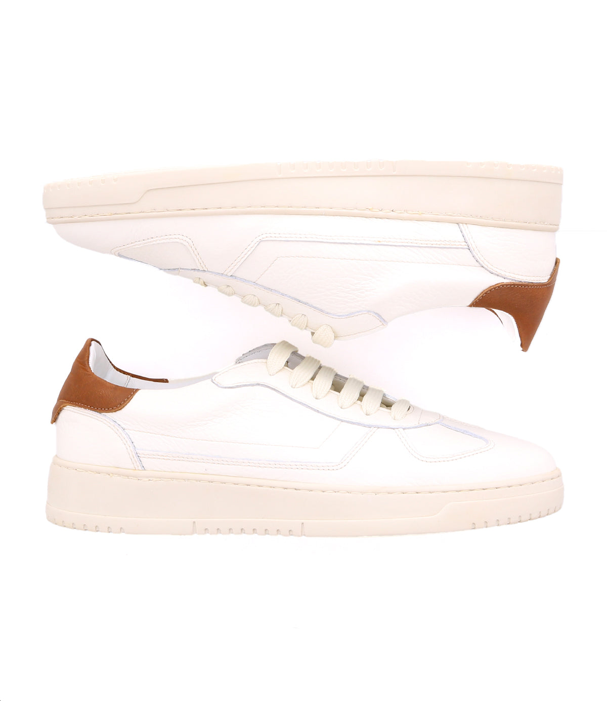 A pair of classic white sneakers, crafted from high-quality leather, featuring beige soles and light brown heel accents, displayed against a white background. The Bed Stu North is ideal for men's footwear collections.