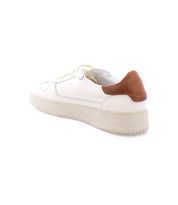 A classic white sneaker with a thick sole, featuring a high-quality leather brown accent on the heel, displayed from a rear-angle view. Perfect men's footwear for any occasion. Introducing the Bed Stu North.