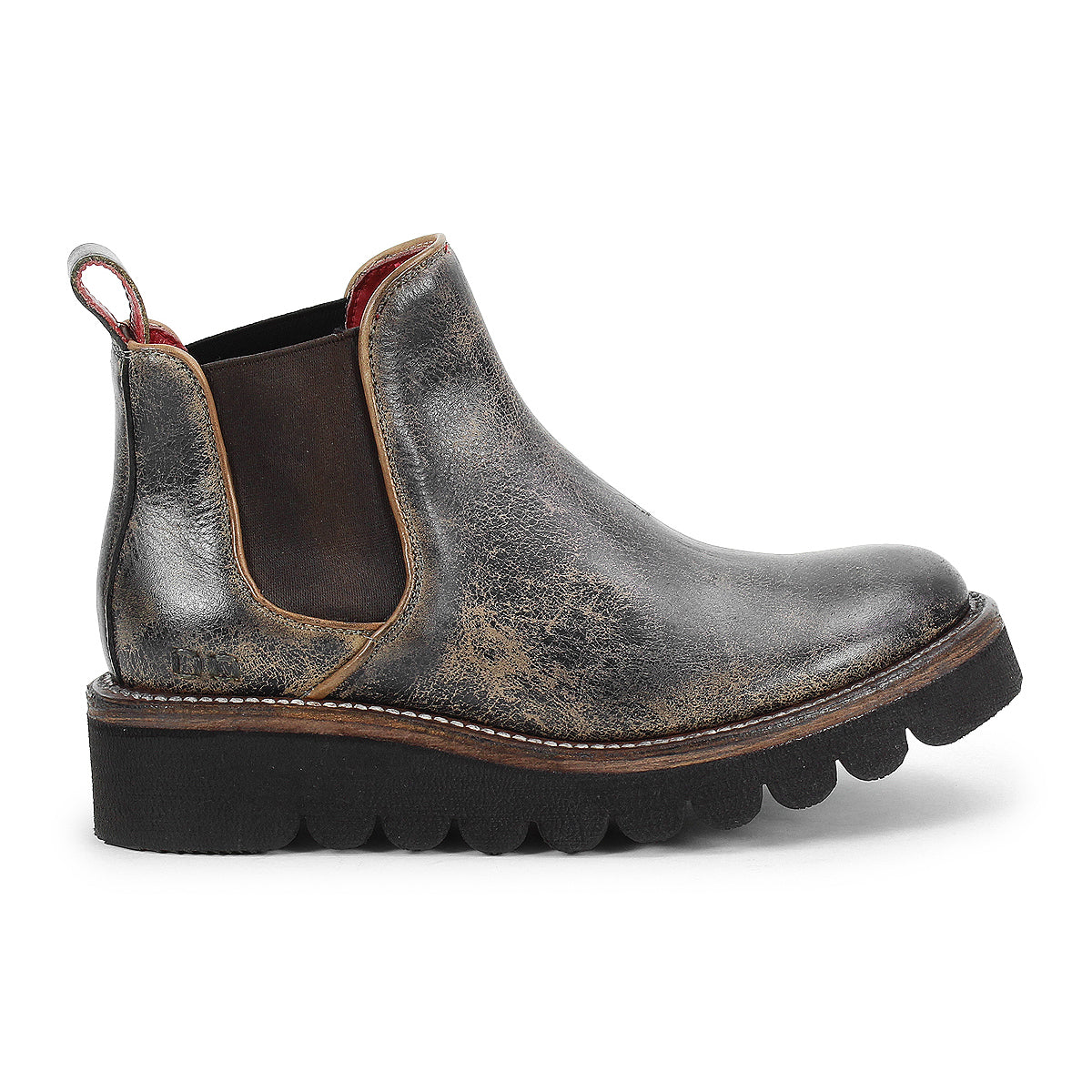The Bed Stu Novel II is a worn-in leather Chelsea boot featuring elastic side panels, a pull tab, rugged texture, round toe, and a thick black scalloped lightweight sole.