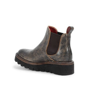 The Bed Stu Novel II is a single brown Chelsea boot with a leather upper, elastic side panel, pull tab, and thick black ridged sole, displayed on a white background.