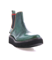 The Bed Stu Novel II is a green leather Chelsea boot featuring black elastic side panels, a pull tab, and a thick yet lightweight sole, shown against a white background.