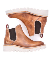 Bed Stu Novel II brown leather Chelsea boots featuring a lightweight sole, elastic side panels, and pull tabs, shown side by side on a white background.