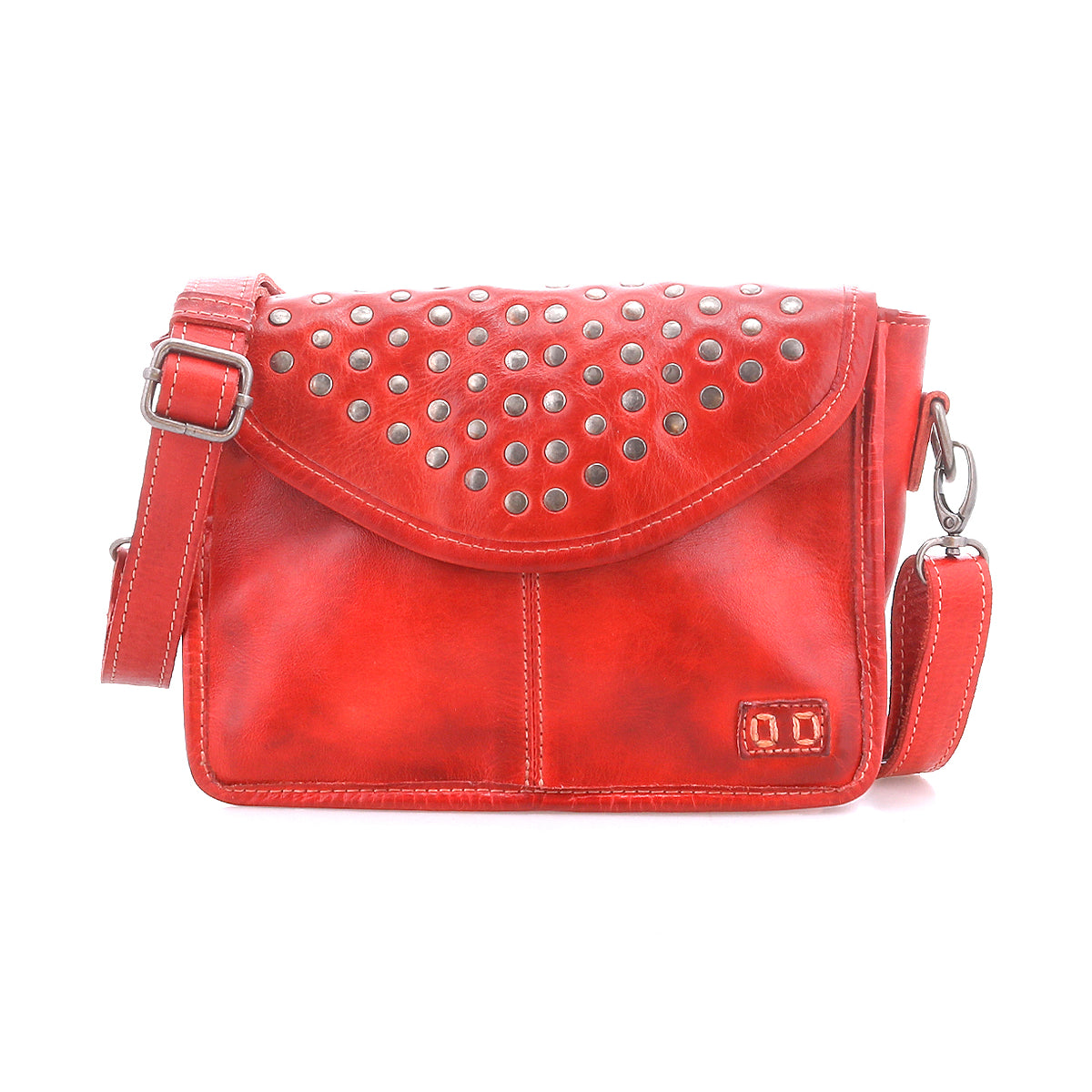 Bed Stu’s Occurrence crossbody is a compact red leather bag accented with silver studs on the flap and features an adjustable shoulder strap for effortless style.