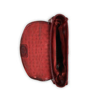 Top-down view of the Bed Stu Occurrence: an open red leather crossbody bag featuring a polka dot interior and button clasp.