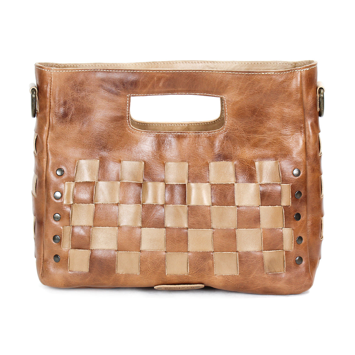 The Orchid by Bed Stu is a brown leather handwoven handbag with checkerboard panels, a cut-out handle, and metal stud accents on the sides.