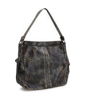 Discover the Packet LTC by Bed Stu, a distressed brown leather tote featuring metal stud details and a curved top handle – an ideal choice for those looking for a versatile travel companion.