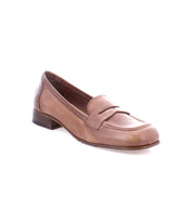 A classic style brown leather penny loafer with a low heel is shown against a white background, featuring luxurious Italian leather craftsmanship. The shoe, named Paris by Bed Stu, exemplifies refined elegance in every detail.