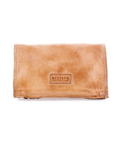 The Parle by Bed Stu is a tan leather wallet featuring a stitched "BED|STU" label on the front and zippered compartments for added security.
