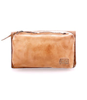 The Parle by Bed Stu is a versatile tan leather bag with a front zippered compartment and a discreet corner logo.