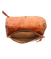 Top view of the Bed Stu Parle brown leather 3-in-1 bag with a visible zipper, inner lining, and versatile crossbody strap.