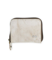 The Peek by Bed Stu is a compact beige zippered wallet made from premium leather with a subtle texture. It features a small double square logo in the bottom right corner and has convenient card slots inside.