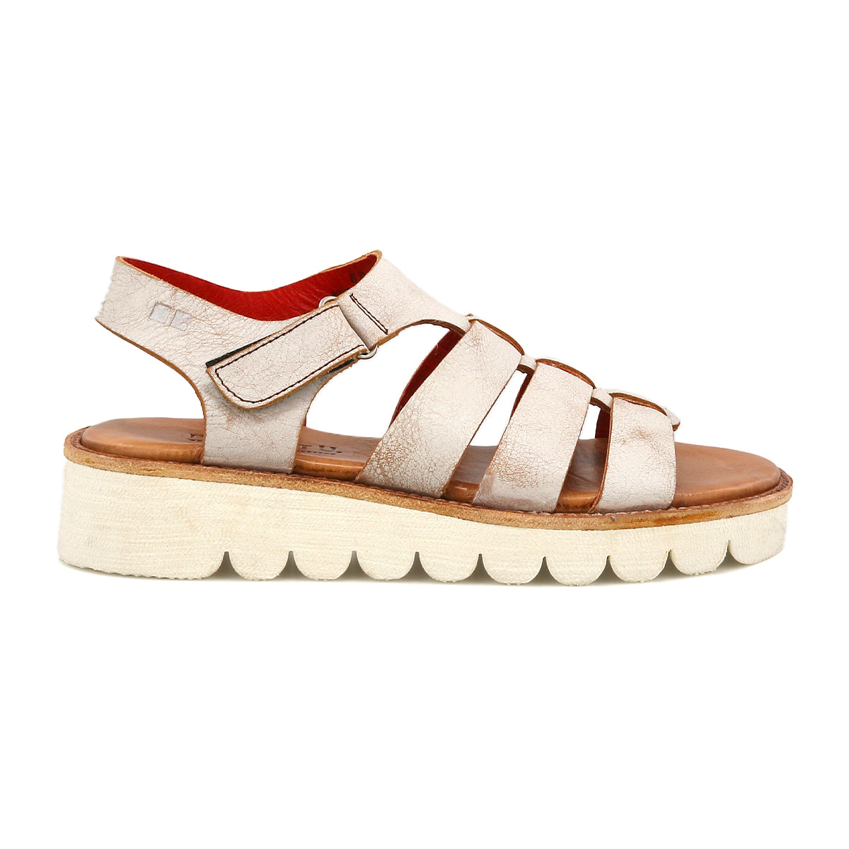 The Bed Stu "Perfect" sandal features beige leather, multiple straps, a thick textured platform sole, and a cushioned footbed, inspired by modern fisherman styles and shown in side profile.