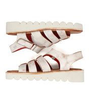The Bed Stu Perfect sandals feature metallic gold leather, thick scalloped white soles, cushioned footbeds, and adjustable buckles.