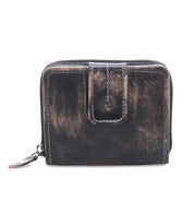 The Bed Stu Plus is a compact, square black leather wallet featuring a zipper closure, front strap, and zippered coin pocket, shown against a white background.