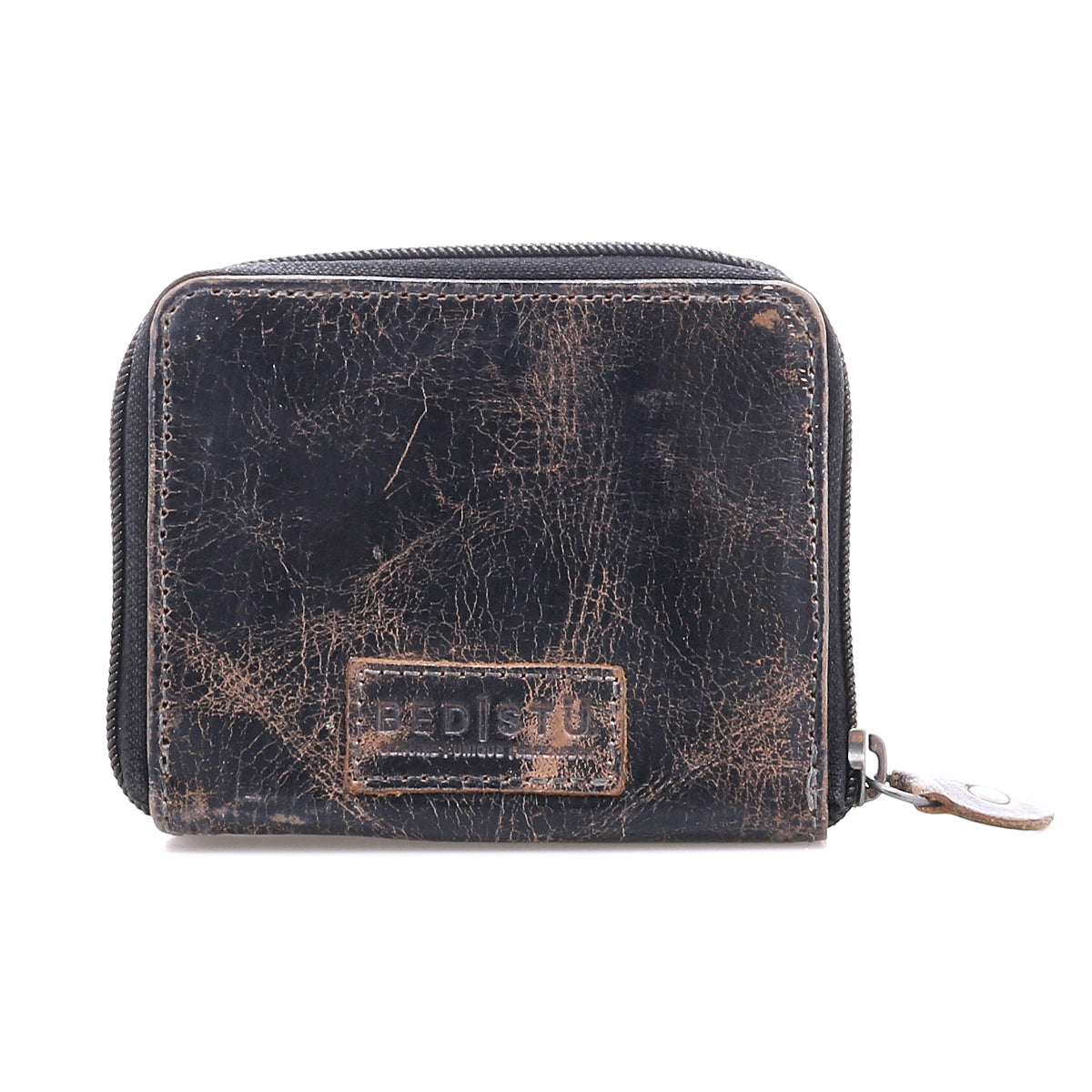 A worn black compact leather wallet by Bed Stu, called Plus, featuring visible creases, a front rectangular embossed patch, and a zippered coin pocket.