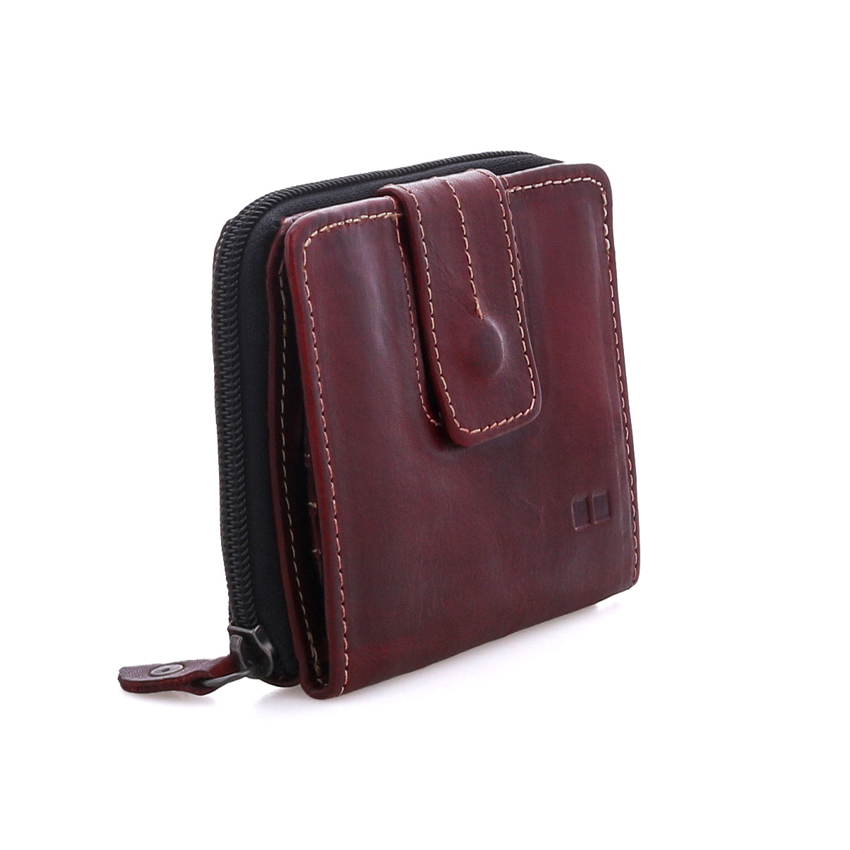 The Bed Stu Plus is a compact brown leather wallet with contrast stitching, snap closure, and edge zippered coin pocket, shown standing upright on a white background.
