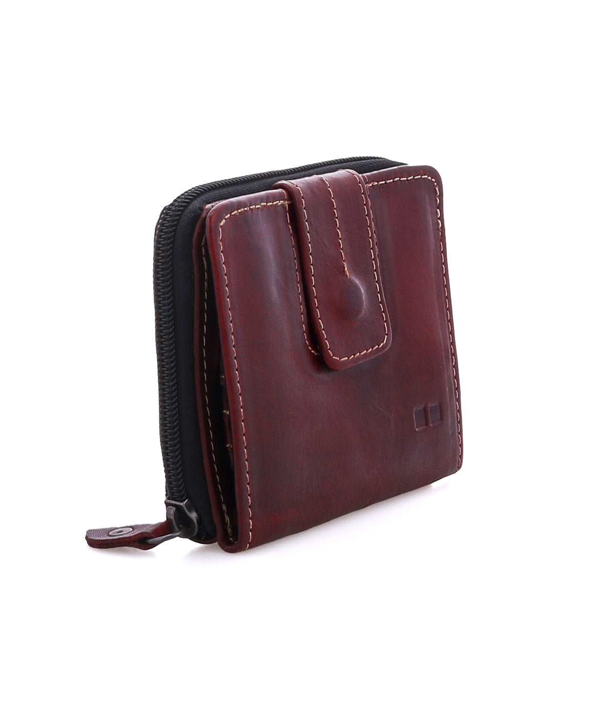The Bed Stu Plus is a compact brown leather wallet with contrast stitching, snap closure, and edge zippered coin pocket, shown standing upright on a white background.