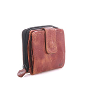Bed|Stü Plus brown leather bifold wallet featuring a snap closure and an exterior zippered coin pocket.