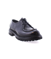 The Portare by Bed Stu is a black leather lace-up shoe with a rugged, thick sole and a vintage-inspired design, expertly crafted in an Italian factory.