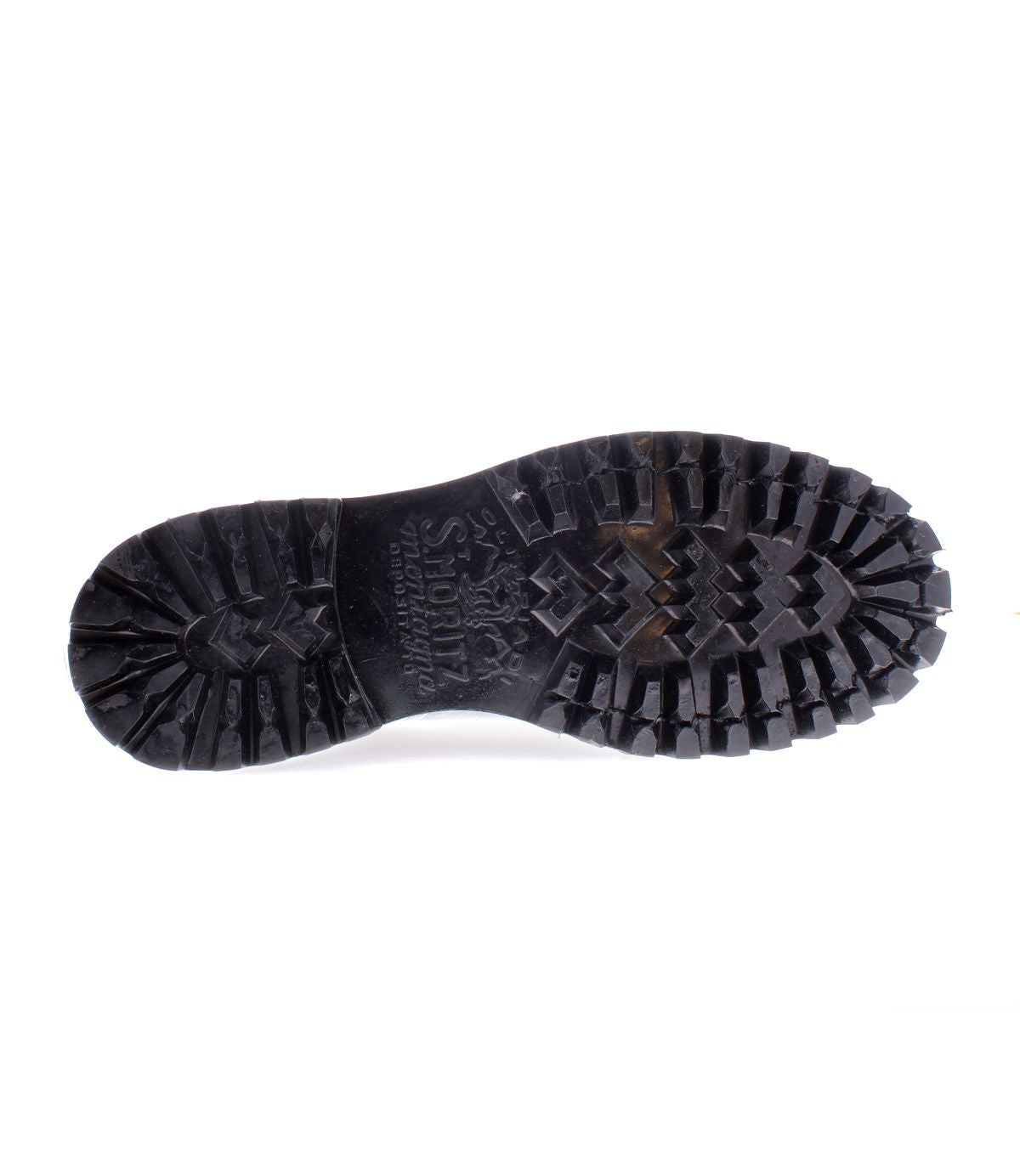 The image displays the sole of the Portare boot from Bed Stu, featuring a vintage-inspired black design with deep treads reminiscent of a moc-toe lace-up style, set against a crisp white background.