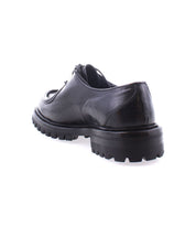 Portare by Bed Stu, a black leather shoe featuring a rugged, chunky Livetech outsole, viewed from the back on a white background.