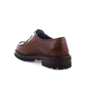 The Portare by Bed Stu is a brown leather shoe with a rugged, chunky Livetech outsole, viewed from the back, showcasing Italian artistry in every stitch.
