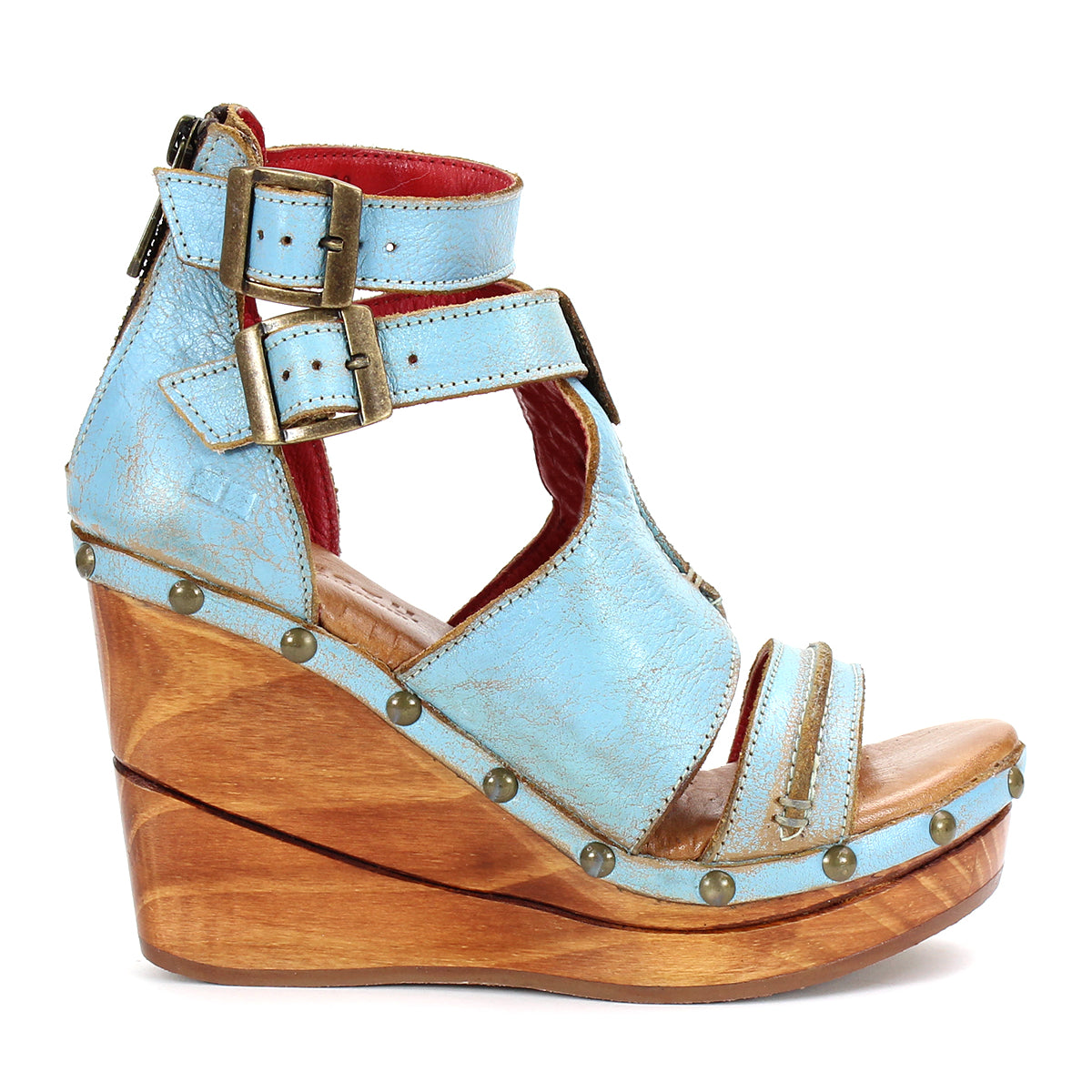 A women's blue wedge sandal called "Princess" from the brand "Bed Stu" with sustainable wooden platform and woven strappy uppers.