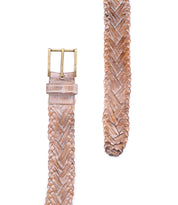 The Bed Stu Proem is a tan handwoven leather belt with a vintage metal buckle, shown laid flat on a white background—ideal for adding rustic, casual style to any outfit.
