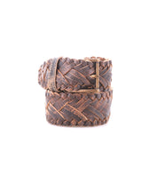 The Bed Stu Proem is a coiled, brown handwoven leather belt with a vintage metal buckle, shown against a plain white background—ideal for rustic casual style.