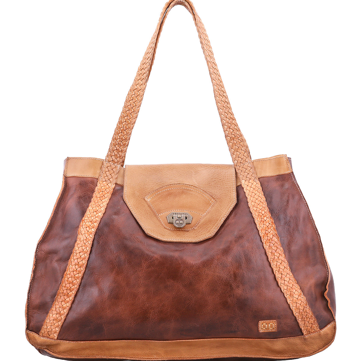 The Proper tote by Bed|Stü is a spacious, vegetable-tanned leather bag in a rich brown shade, featuring handwoven braided shoulder straps, a front clasp, and a subtle metal logo plate on the lower right corner. Its interior is lined with organic cotton for enhanced durability and comfort.