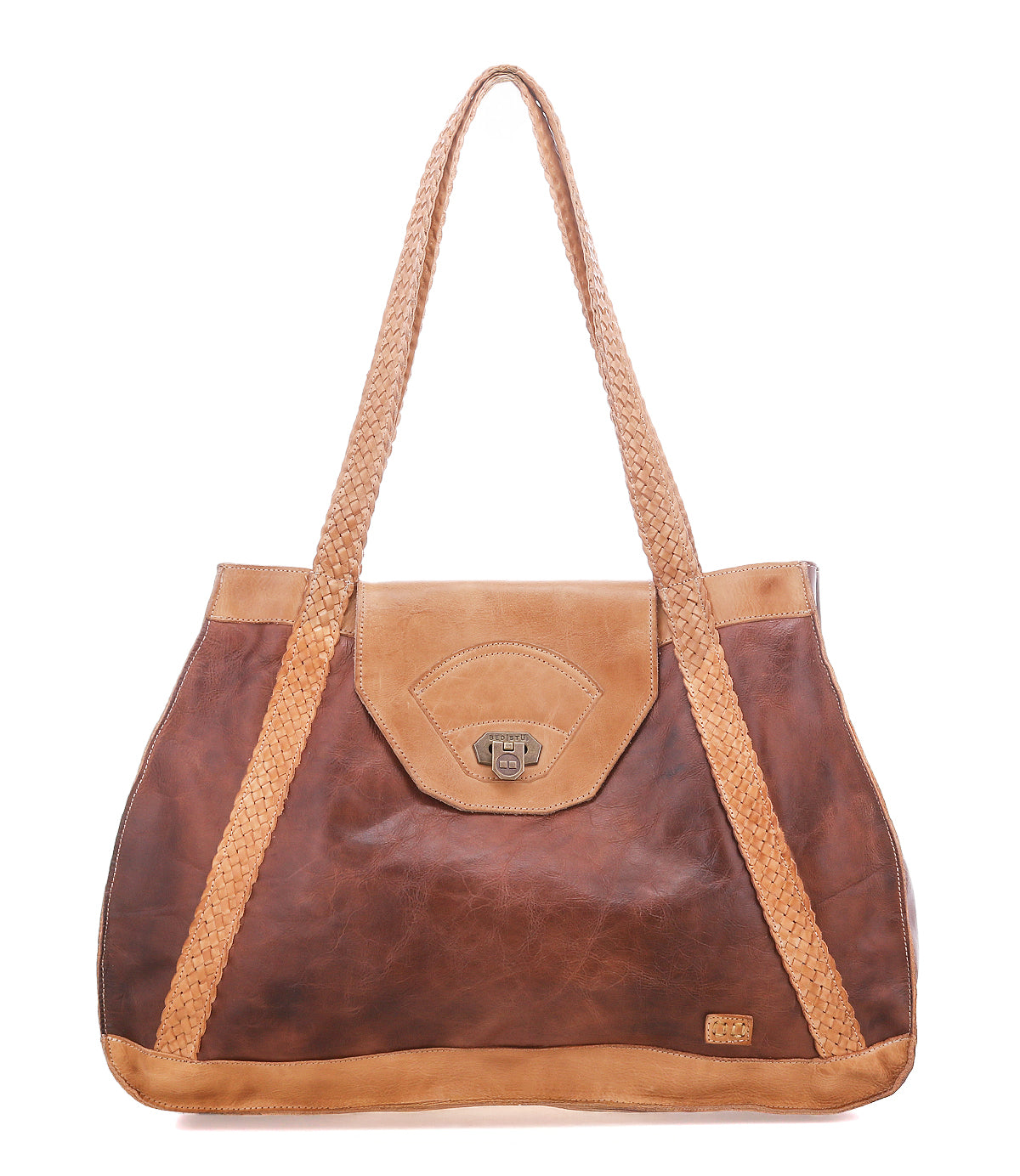 The Bed|Stü Proper is a two-tone brown leather tote with handwoven shoulder straps, flap closure, and a small metal logo plate on the lower right corner.