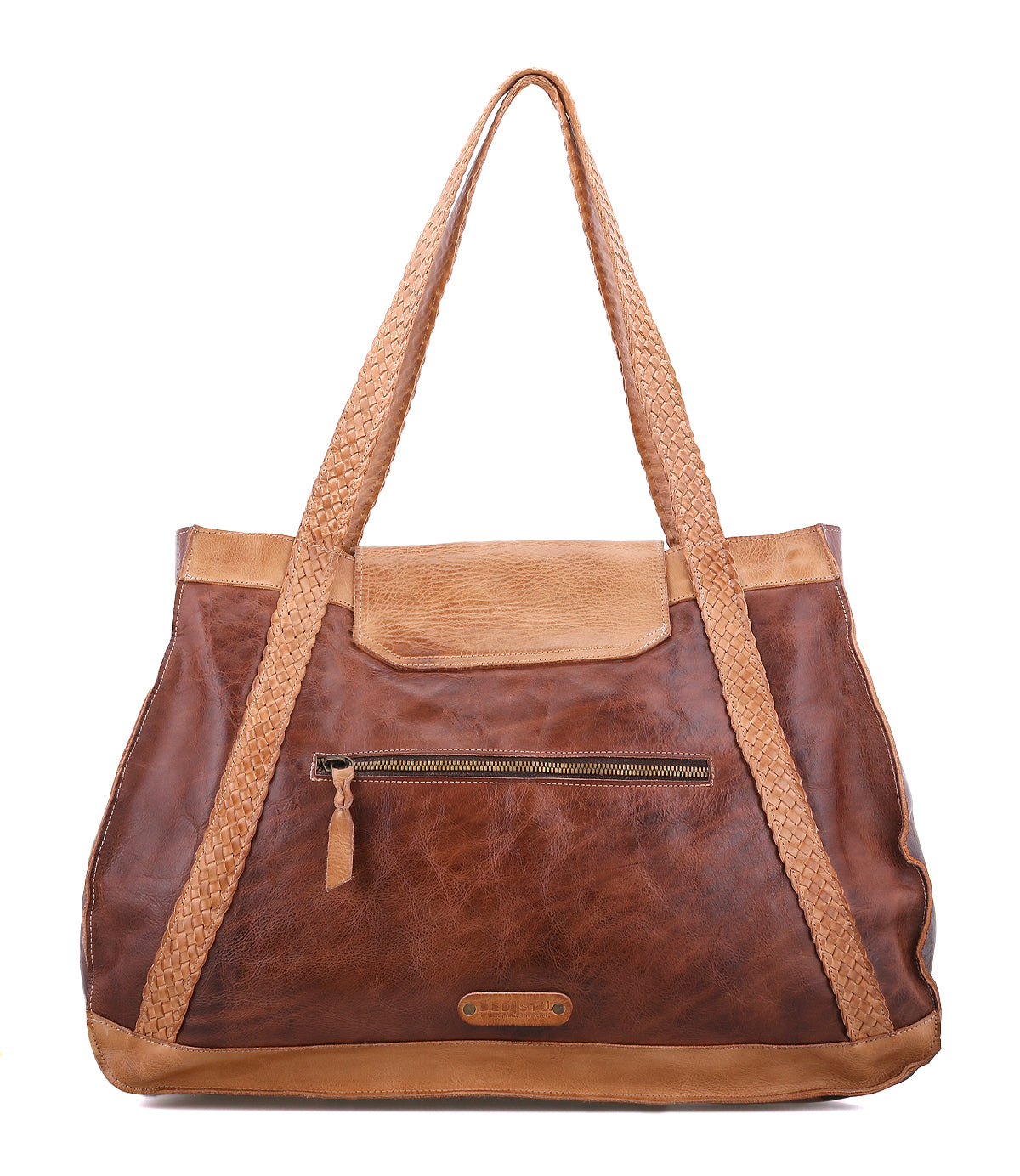 The Bed|Stü Proper is a brown vegetable-tanned leather tote bag with handwoven, braided handles, a front zippered pocket, and tan accents along the top edge and handles. It features an organic cotton-lined interior and is shown against a white background.
