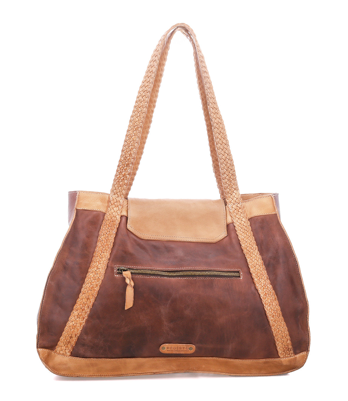 The Proper by Bed|Stü: a brown leather everyday tote with tan accents, handwoven straps, front zip pocket, and flap closure on a white background.