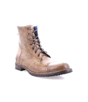 The Bed Stu Protege is a single brown leather lace-up boot featuring a rugged design and robust traction, shown from the side view.