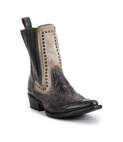 The "Raise" Western boot by Bed Stu is available in black and beige, showcasing decorative stitching, studded accents, and a low heel.