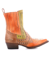 Discover the Bed Stu Raise boot, showcasing a vibrant blend of brown and orange with western stitching, brass studs, and a low wooden heel.
